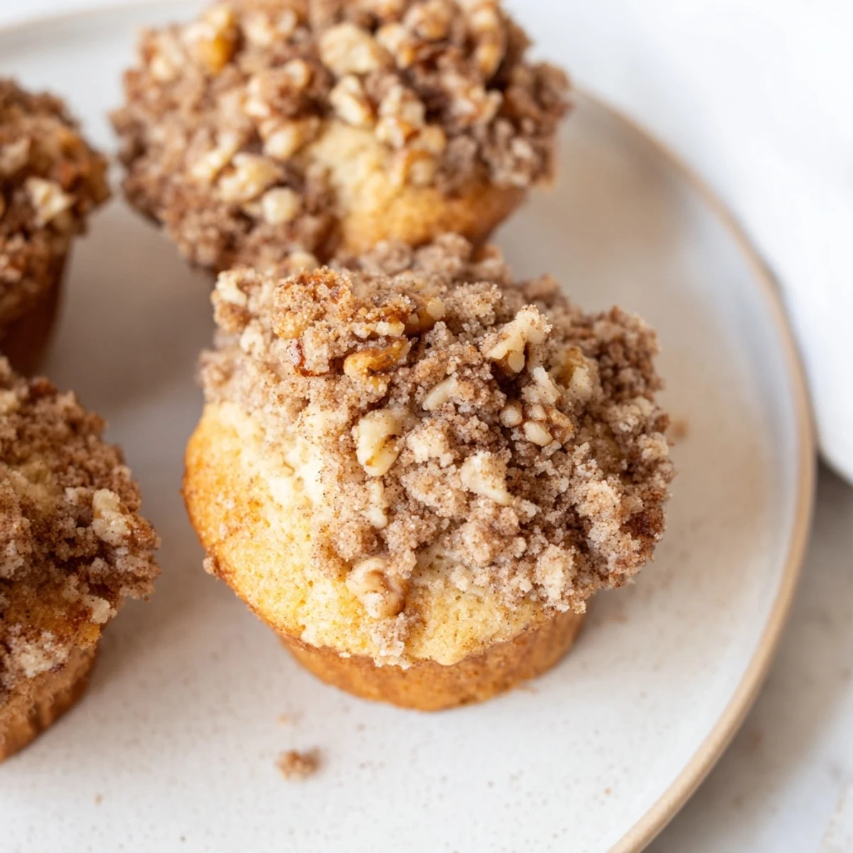 Warm cinnamon nut streusel muffins fresh from the oven, perfect with morning coffee.