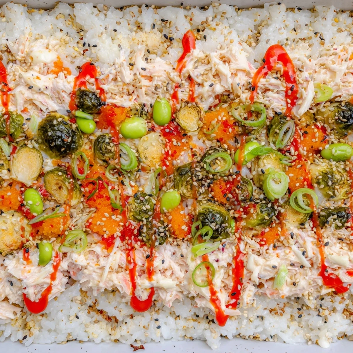 A vibrant photo of TikTok viral sushi bake brimming with colorful roasted vegetables and creamy crab.