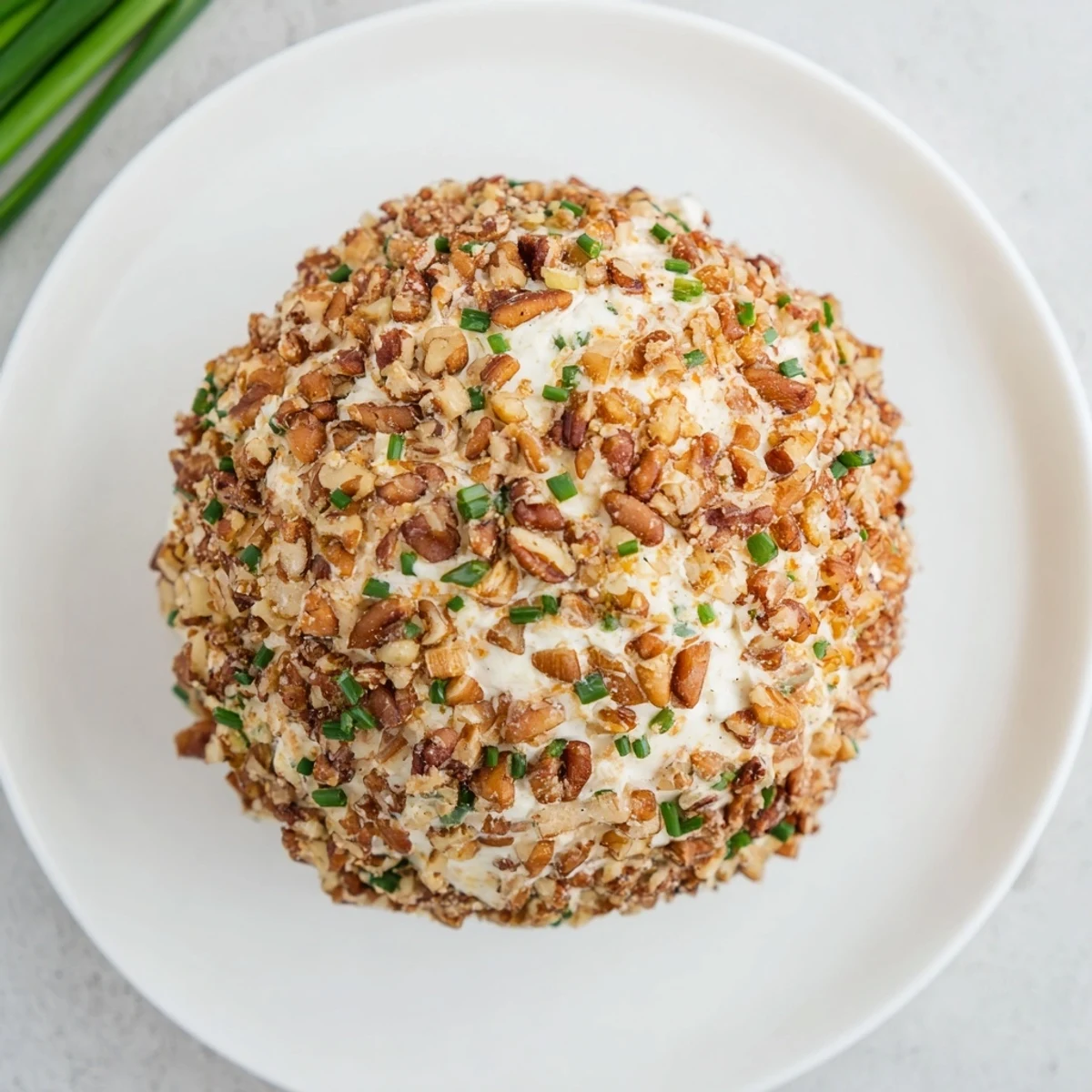 Imagine a creamy Classic Cheese Ball with Ranch Seasoning coated in pecans, perfect for your next gathering.