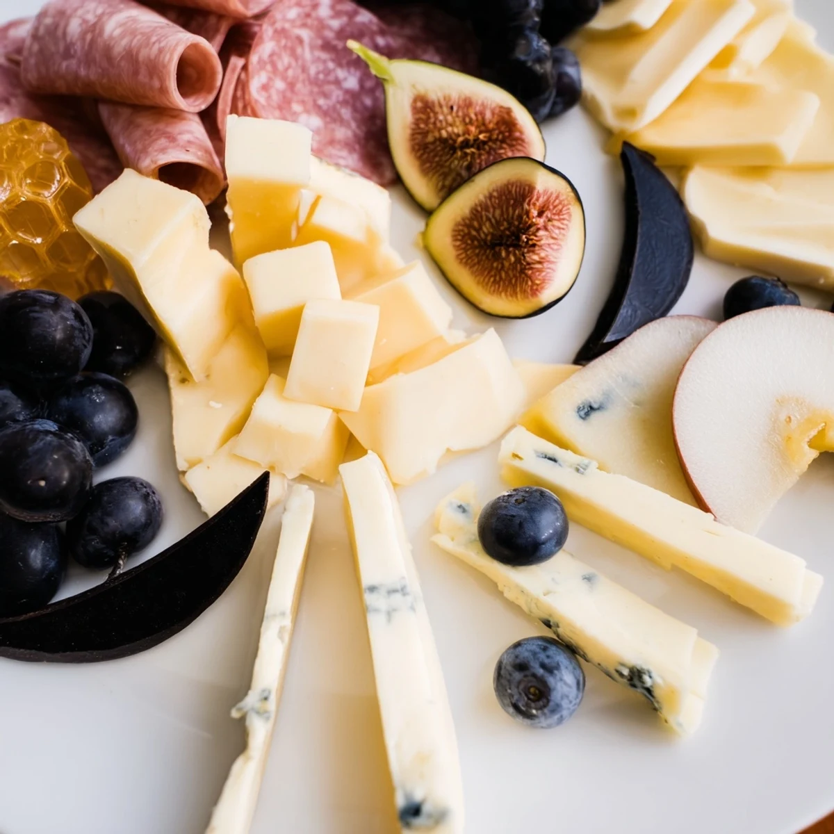 A vibrant Celestial Night Board, showcasing the deep blues of blueberries, figs, and artisan cheeses.