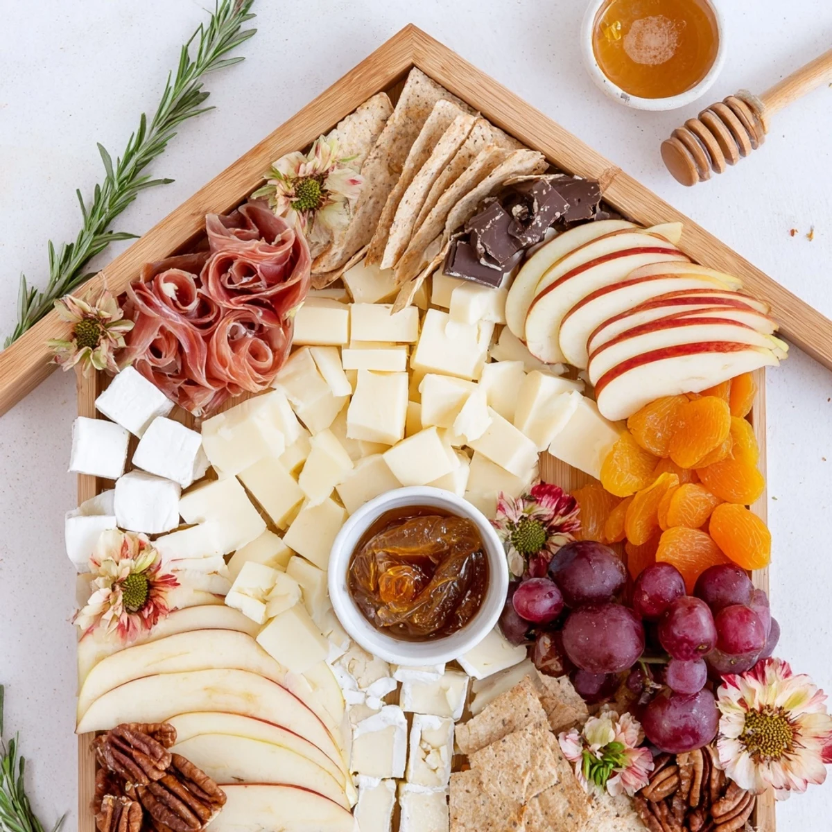 Delectable Sweet Home Charcuterie Board, featuring fresh fruits, cheeses, and candied pecans in a festive arrangement.