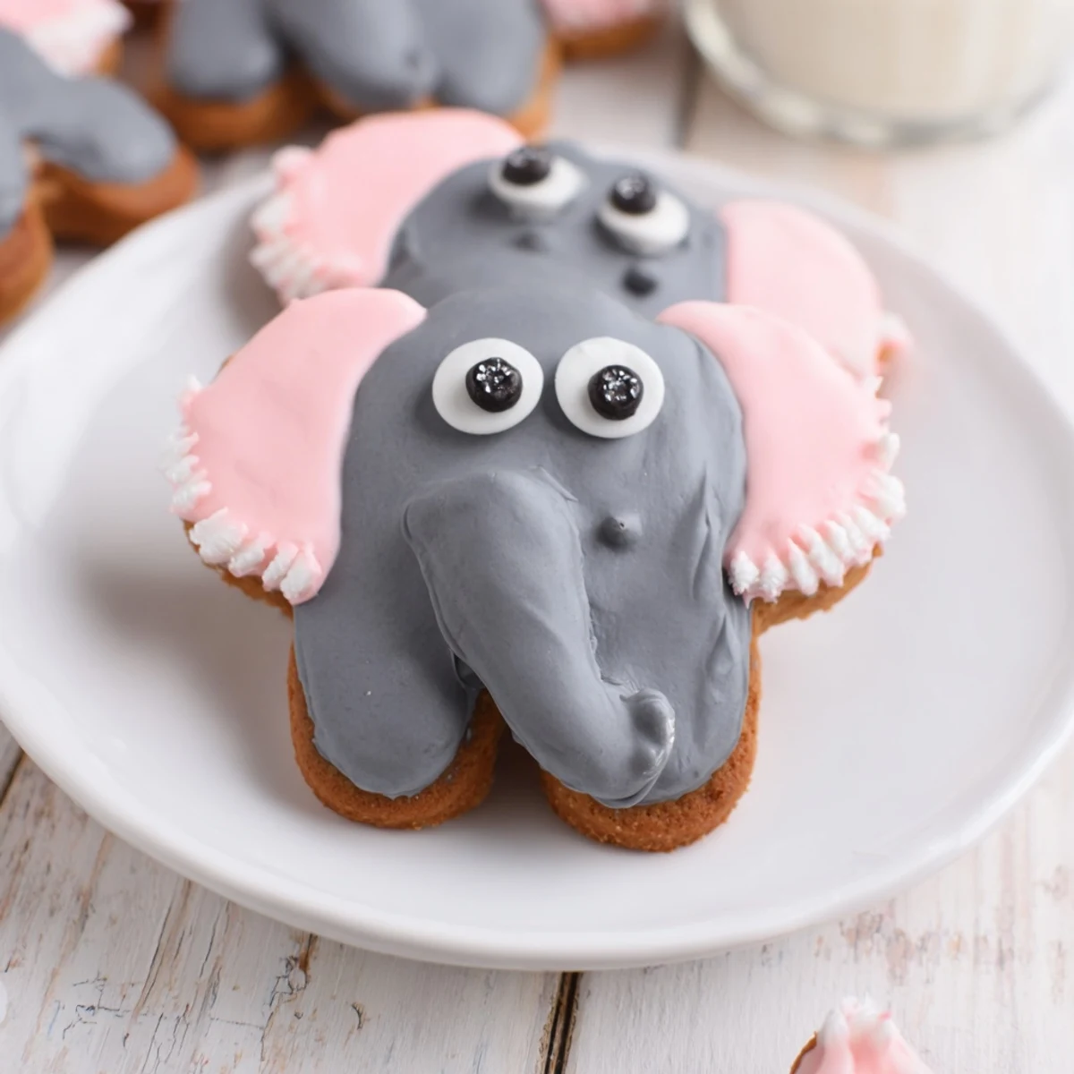 A plate of freshly iced Biscuits Amical Éléphant Géant, perfect for a kids' party treat.