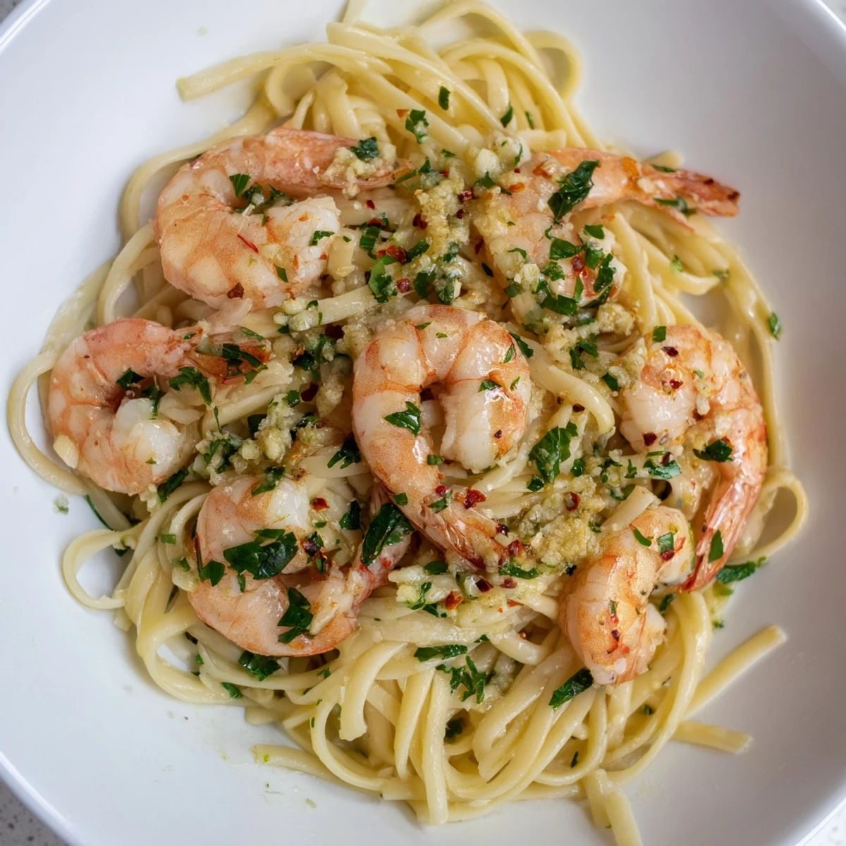 Golden-brown garlic butter shrimp linguine, a flavorful pasta dish ready to be served hot.
