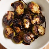 Savory Roasted Brussels Sprouts with Balsamic drizzle, served warm as a perfect vegetarian side dish.