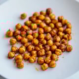 A close-up of Crispy Chickpea Snack with glistening olive oil and spices, perfect for healthy snacking.  