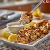 A plate of food with a fork in it.