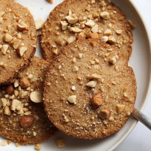 Crisp German hazelnut butter cookies ready to pair with your favorite coffee.  
