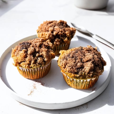 Moist matcha pumpkin muffins topped with buttery streusel, perfect for breakfast.