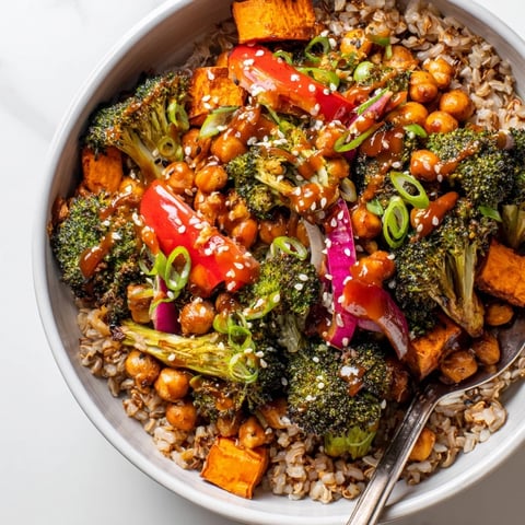 Vibrant Bold Sauce Drizzle Bowls topped with roasted veggies and two flavorful sauces.  