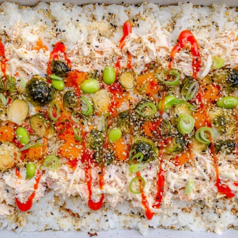 A vibrant photo of TikTok viral sushi bake brimming with colorful roasted vegetables and creamy crab.