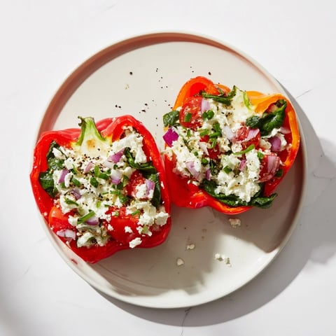Golden Cottage Cheese Stuffed Bell Peppers, bursting with colorful veggies and savory everything bagel seasoning.