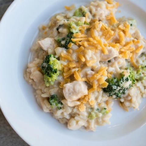 Steaming hot Chicken & Broccoli Rice Casserole, a bubbly family favorite, with golden cheesy topping.