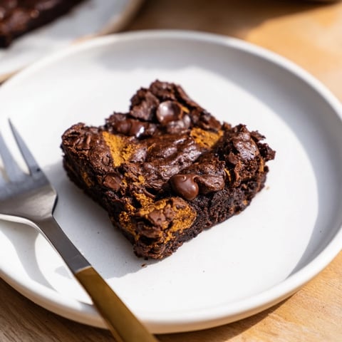 Fudgy, gluten-free Pumpkin Workout Brownies, perfect post-exercise treat, awaiting serving on a plate.