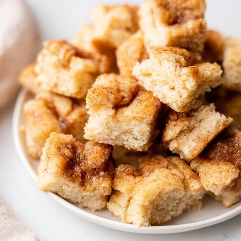 Golden, pull-apart Easy Christmas Morning Monkey Bread glistening with a sweet, warm, vanilla-infused butter glaze.