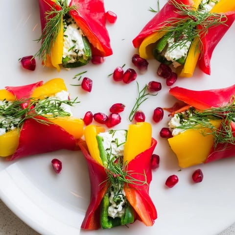 Vibrant Bell Pepper Christmas Bow appetizers; colorful bell pepper bows with creamy, herb-filled centers ready to serve.
