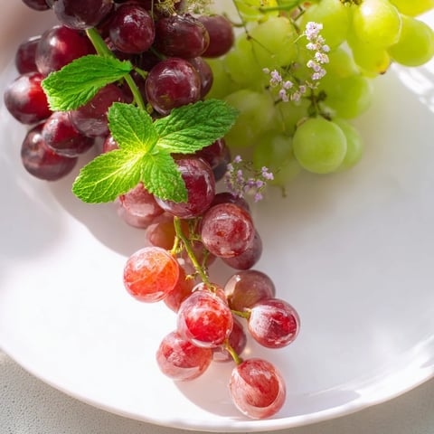 Juicy red and green grapes cascade over the serving board, a visual delight for this easy appetizer.
