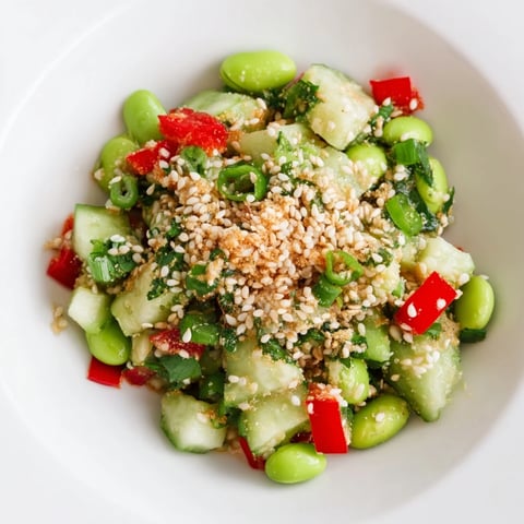 Vibrant Edamame Salad, bursting with fresh veggies and a savory sesame dressing, ready to enjoy.