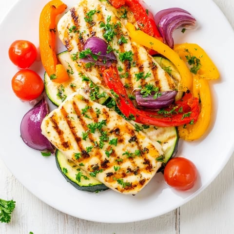Grilled Halloumi Cheese Steaks, perfectly grilled with colorful veggies, are a flavorful vegetarian meal.