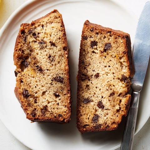 Golden, crusty banana bread loaf with chocolate chips, perfect for a satisfying breakfast treat.