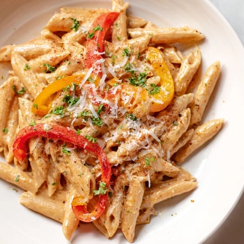 Creamy Cajun Pasta with roasted red peppers, a vibrant and flavorful vegetarian dinner.