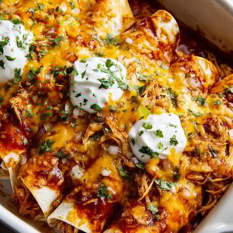 A plate of food with a white sauce on top.