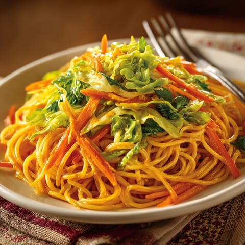 A plate of Thai Peanut Noodles with Shredded Cabbage.
