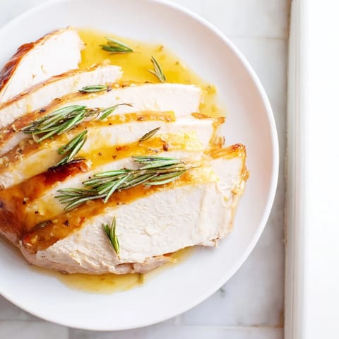 Aromatic, roasted Limoncello-Glazed Roast Turkey Breast, ready to slice for a delightful holiday meal.