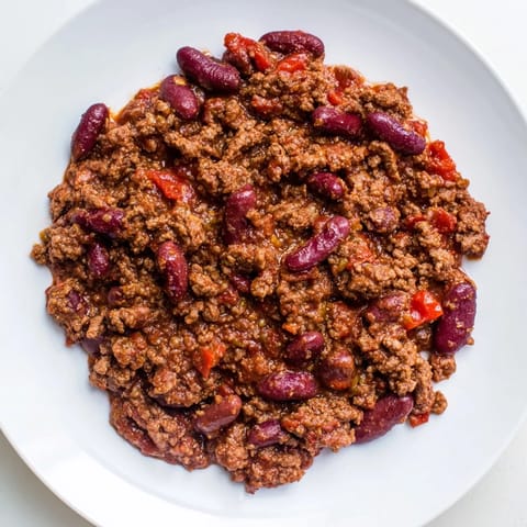 This hearty slow cooker chili dump, featuring ground beef, looks incredibly flavorful and satisfying.