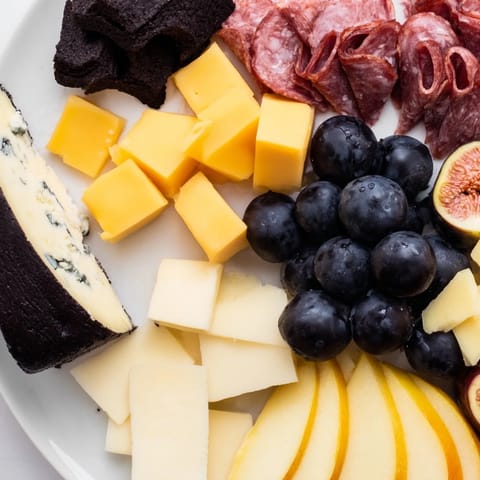 Elegant Celestial Night Board overflowing with cheeses, charcuterie, fruits, and star-shaped chocolates.