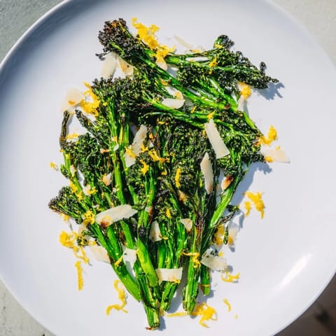 Vibrant Charred Broccolini Salad with bright lemon zest and toasted pine nuts is ready to serve.