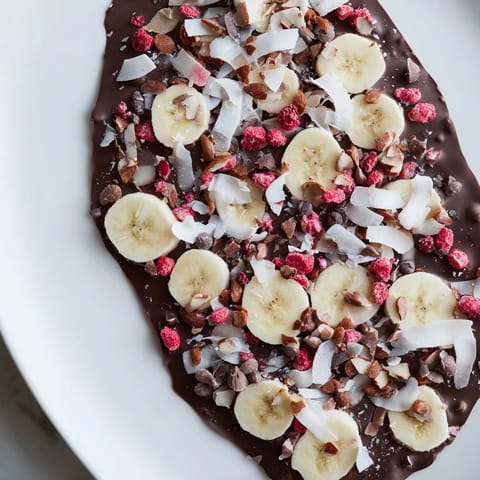 A close-up of delicious Chocolate Banana Bark, showing layers of chocolate and toppings.