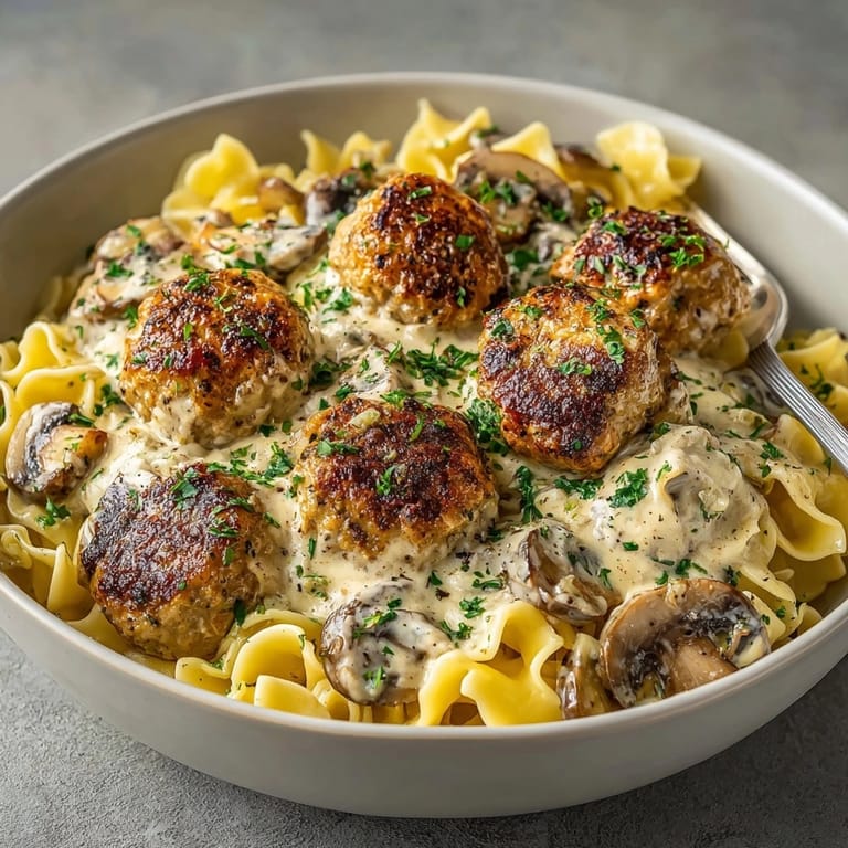 Hearty slow cooker turkey meatball stroganoff portion, garnished with parsley and ready to freeze