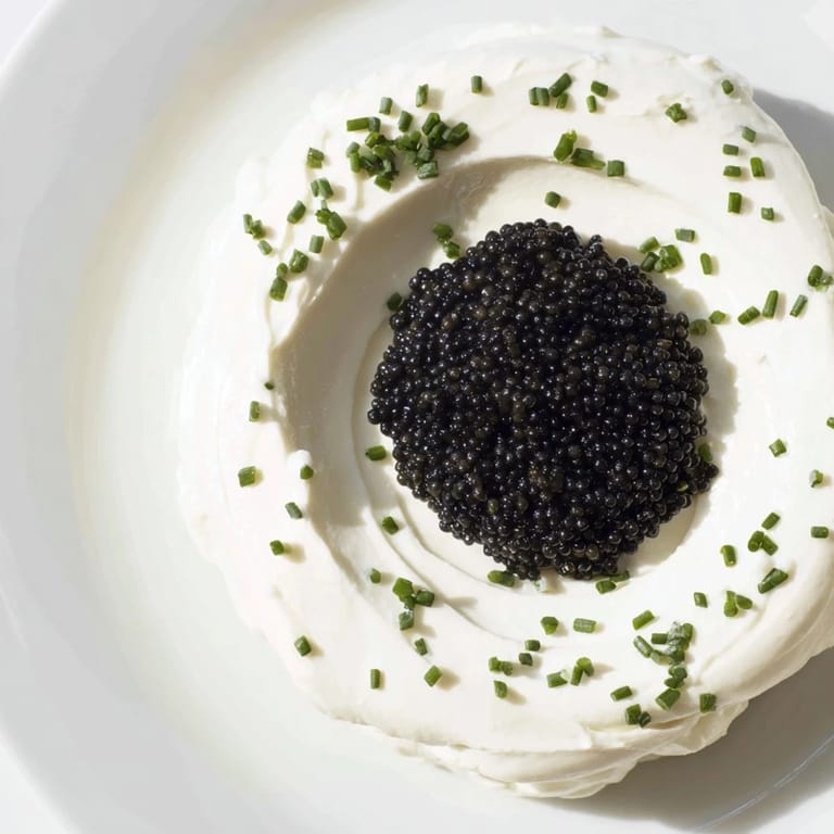 A visually stunning Diamond Inlay: savor the creamy ring of cheese and rich caviar center.