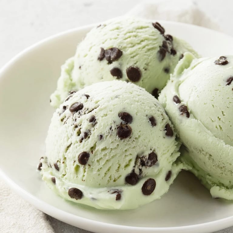 Close-up of refreshing mint chocolate chip ice cream: a perfect summer dessert with a creamy texture.
