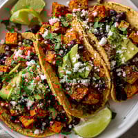 A plate of sweet potato and black bean tacos.